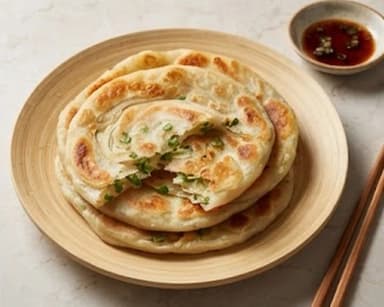 Découvrir la recette Galettes chinoises aux oignons nouveaux