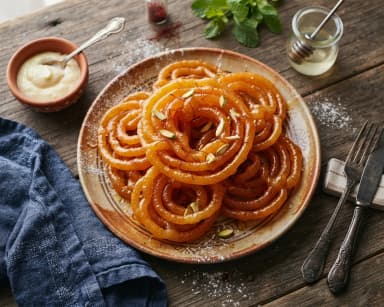 Découvrir la recette Spirales indiennes frites au sirop